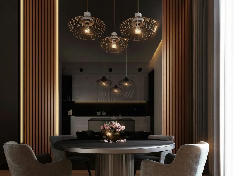 A sophisticated, contemporary dining room with elegant lighting and luxurious furnishings.